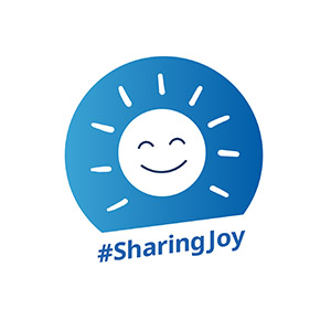 Badge featuring a smiling sun